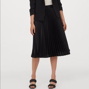 Black pleated midi skirt